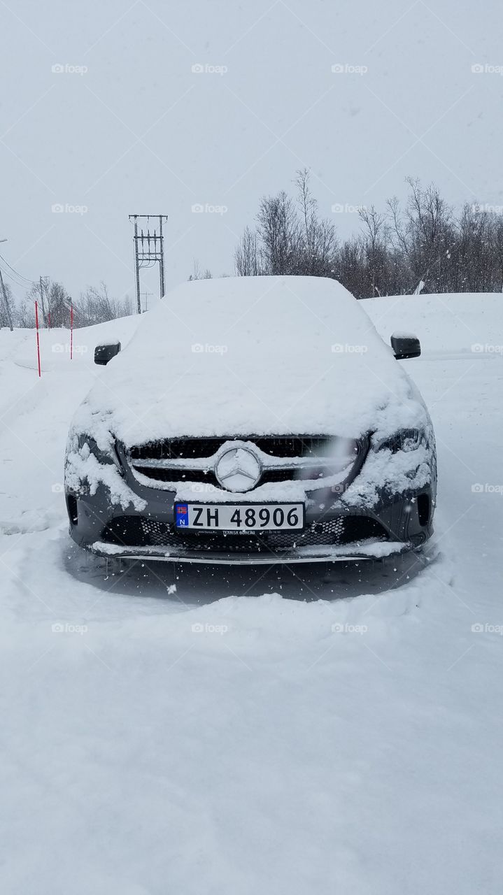 Snow covered car