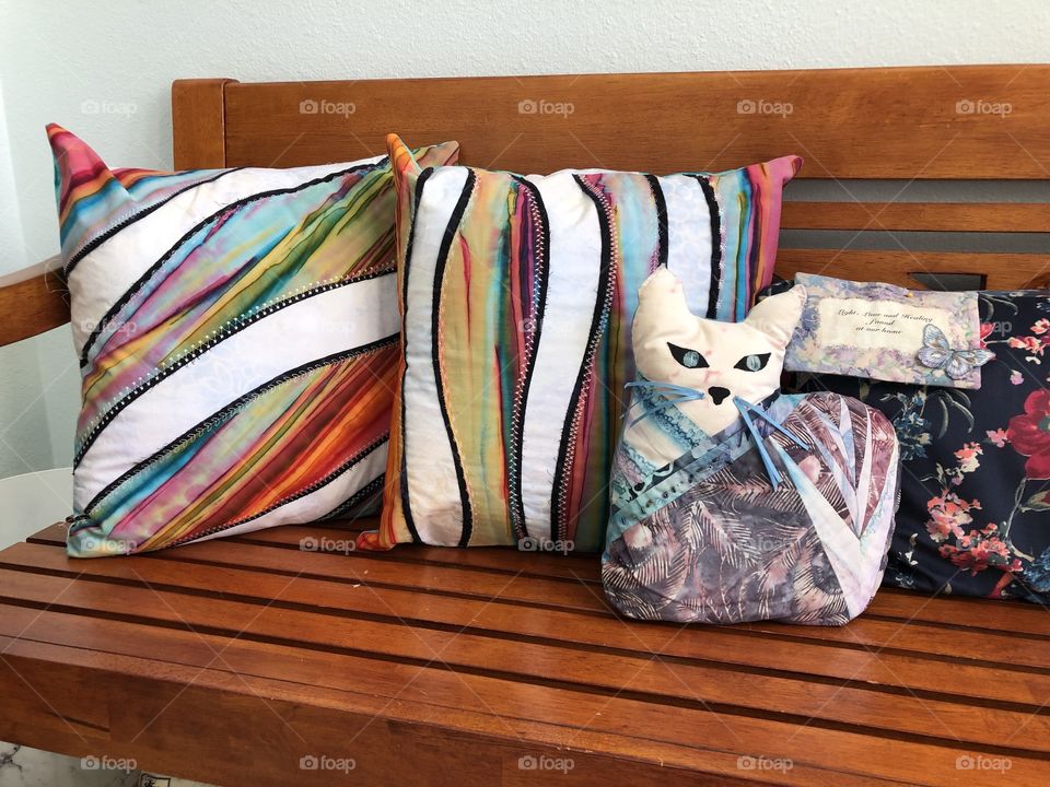 Pillows and a quilted cat