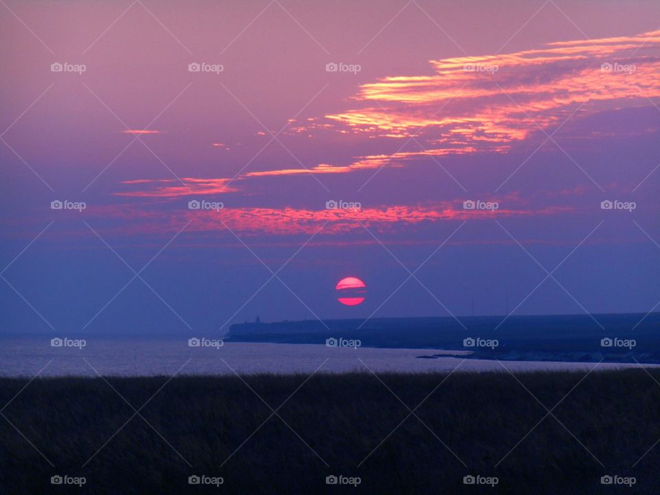 Scenic view of sunset against dramatic sky