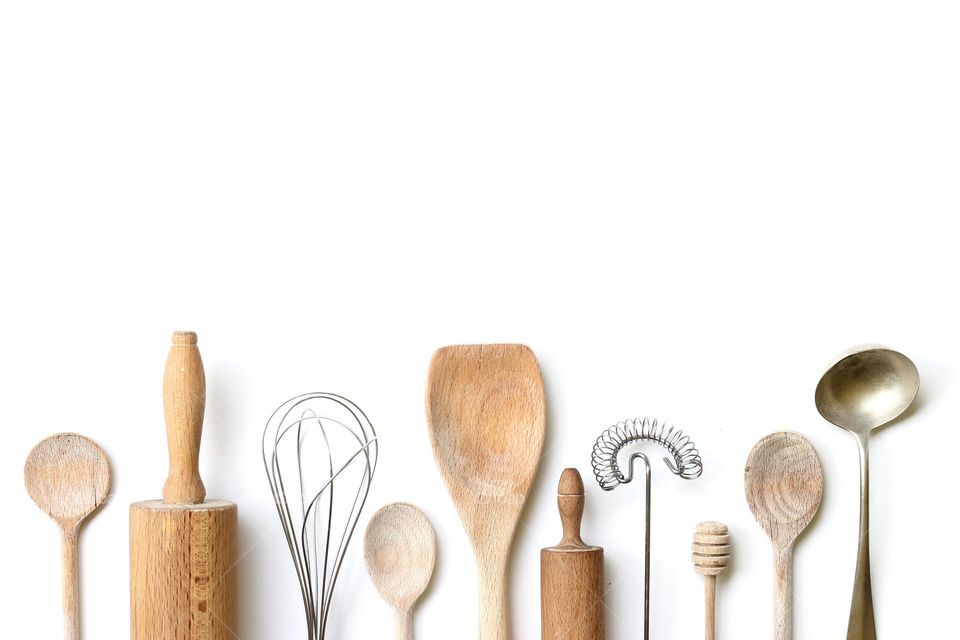 Directly above shot of wooden spoons over white background