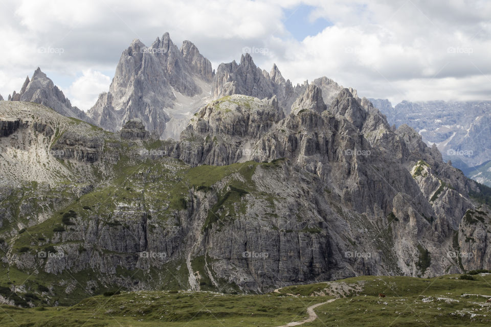 Hiking trail in the mountains, view of mountain peaks 