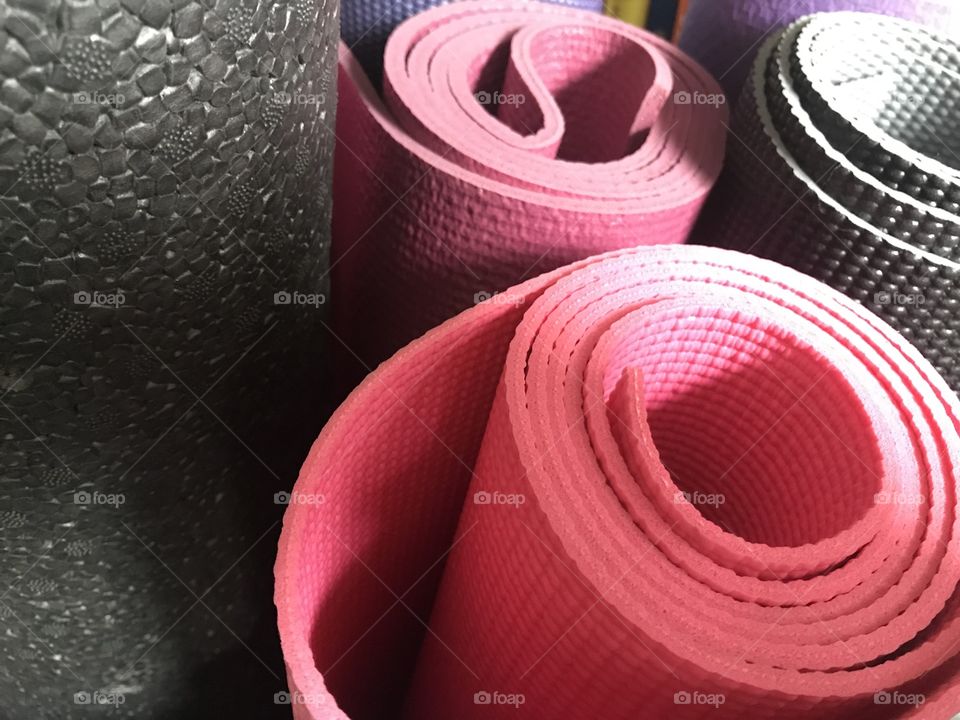 Exercise mats and equipment. Yoga mats and foam rollers are awesome for a great workout. Use pic in any kind of health or exercise blog.
