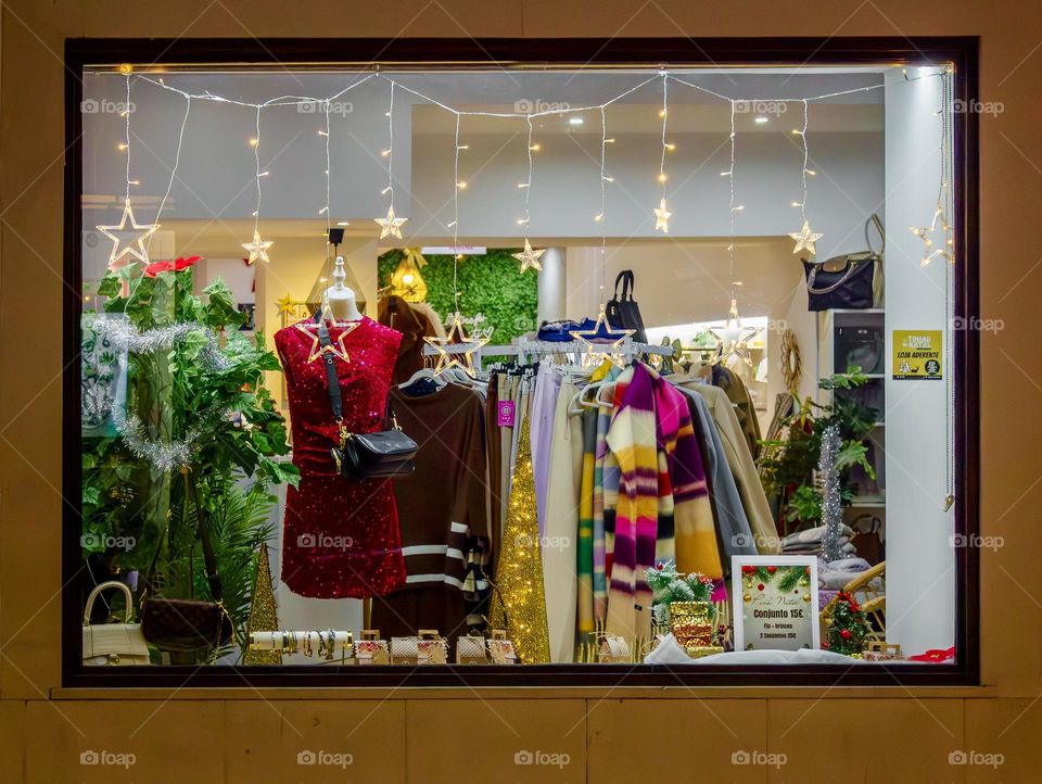 A boutique window twinkling with stars