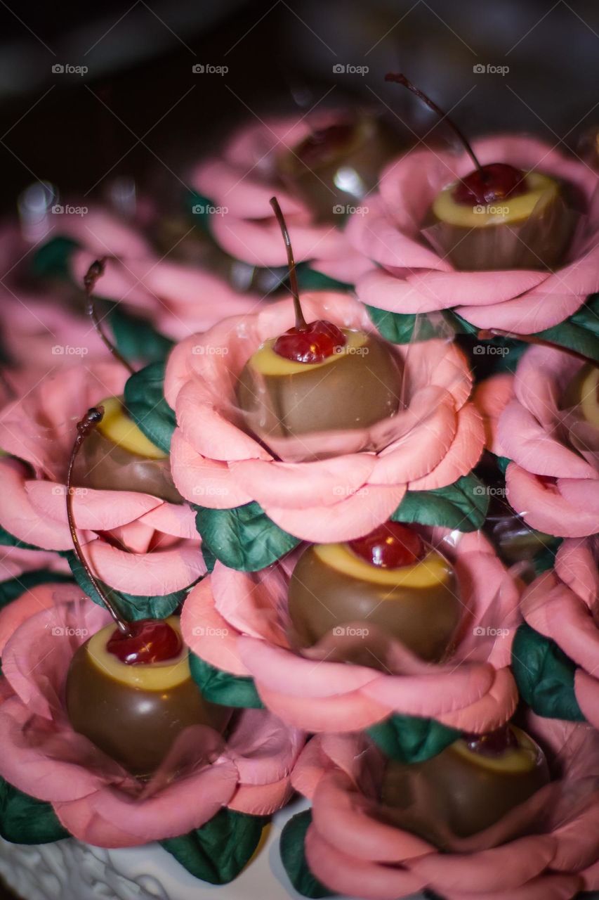 Cherry chocolate sweet in a flower pink mold