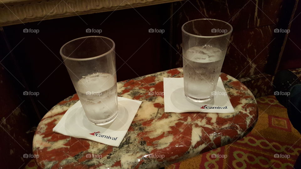 Ice water on napkins on a marble table