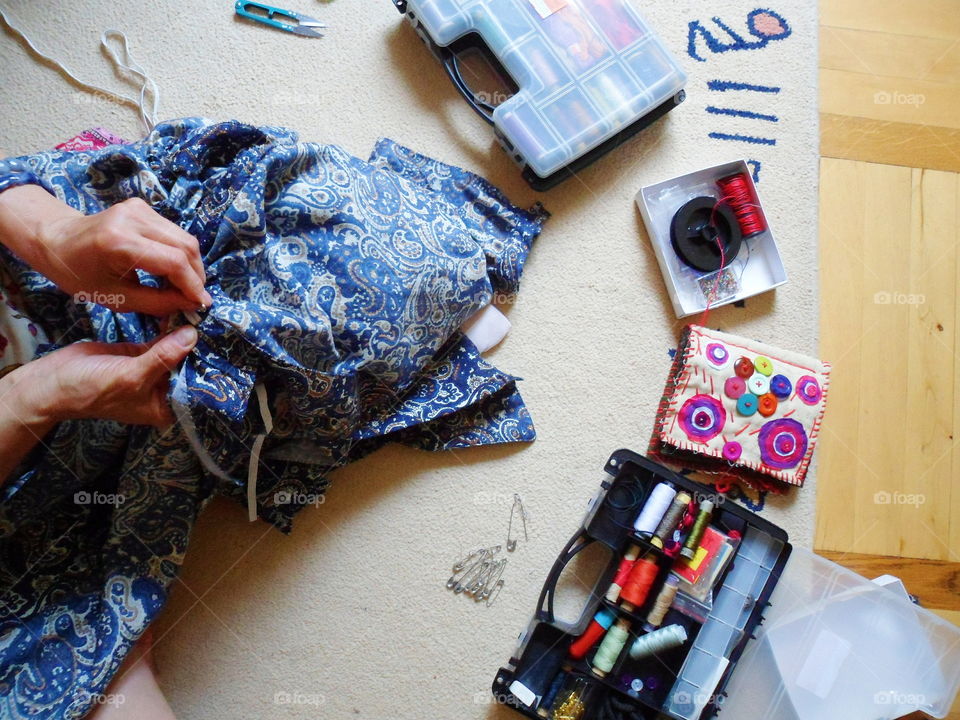 the girl sews a skirt