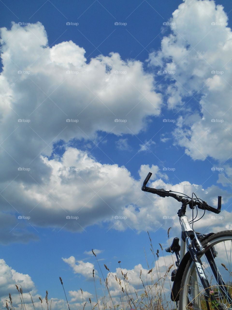 bike on a blue sky clouds beautiful background, summer time