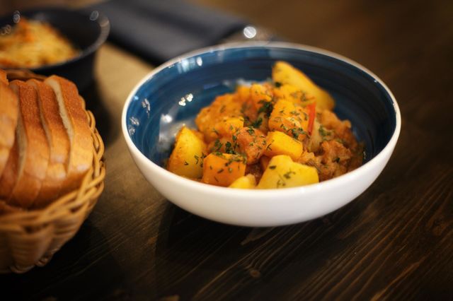 vegetable stew in a blue porcelain plate