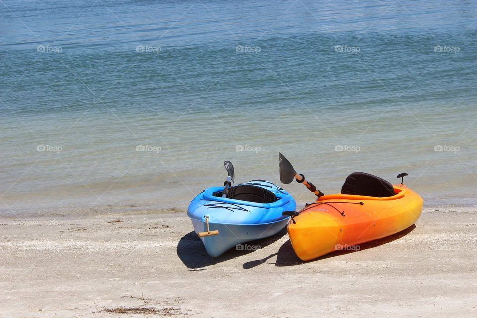 kayaks. two kayaks resting on the shore