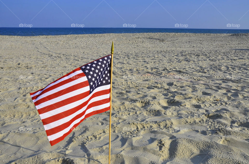 American flag on the beach. 