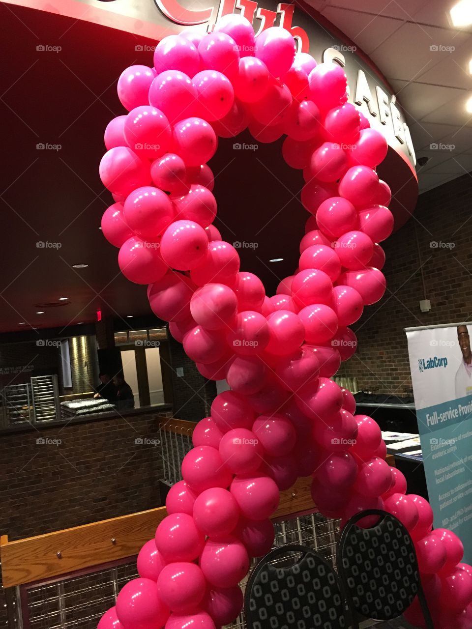 The POZ table with the red AIDS HIV ribbon made of balloons. Located at the Transforming Care Conference in Columbus Ohio for LBGTQ health care professionals.  