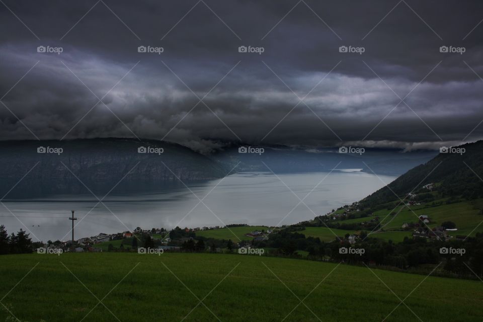 Storm clouds over idyllic lake