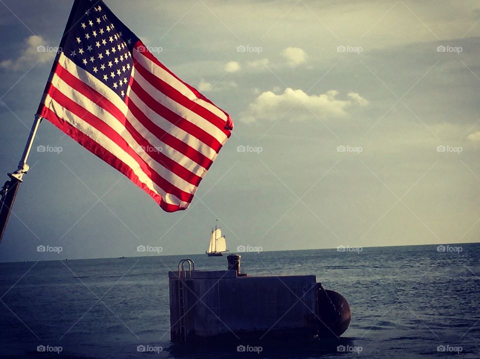 American flag and sailboat