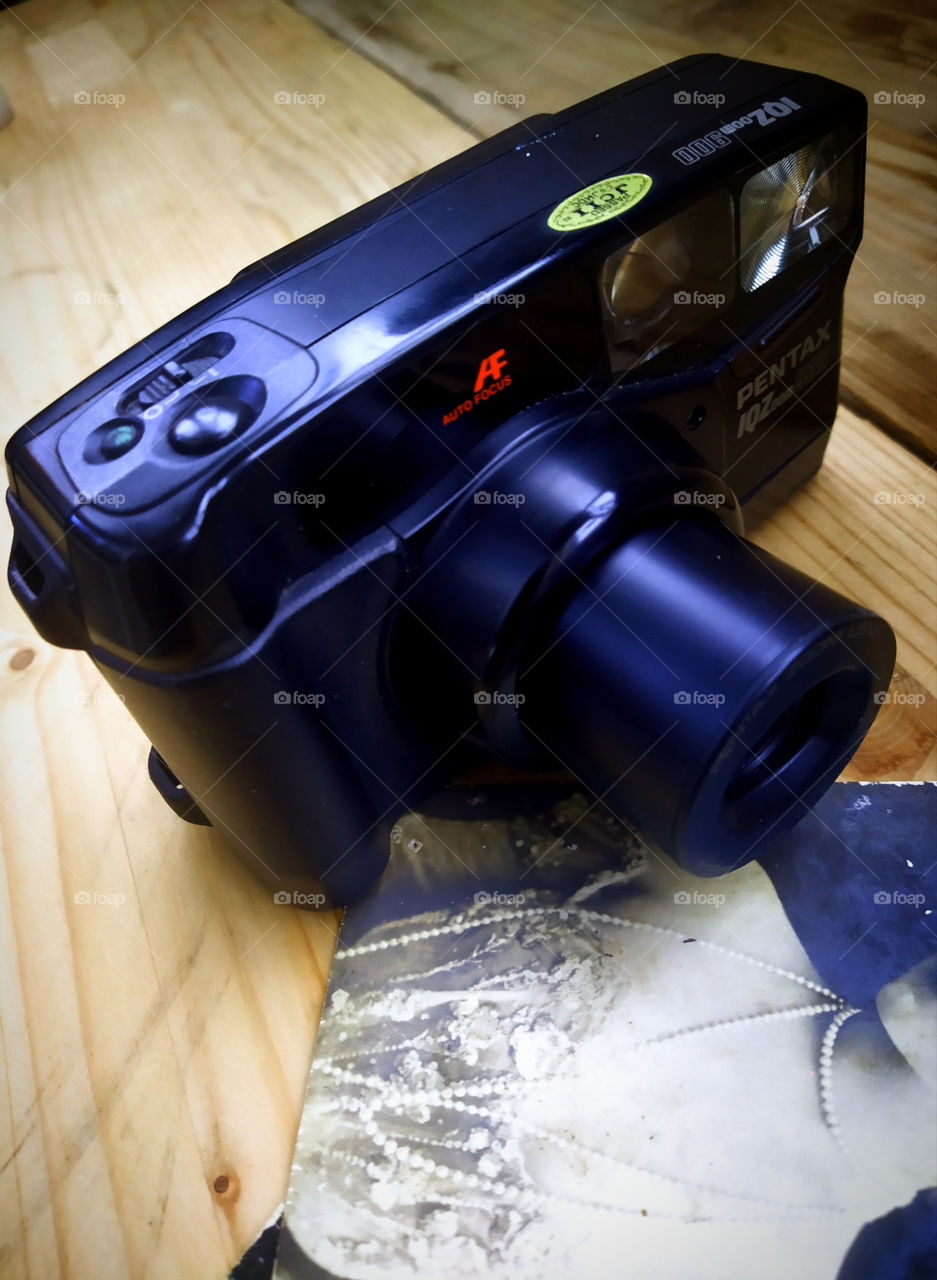 Old film camera and old photograph