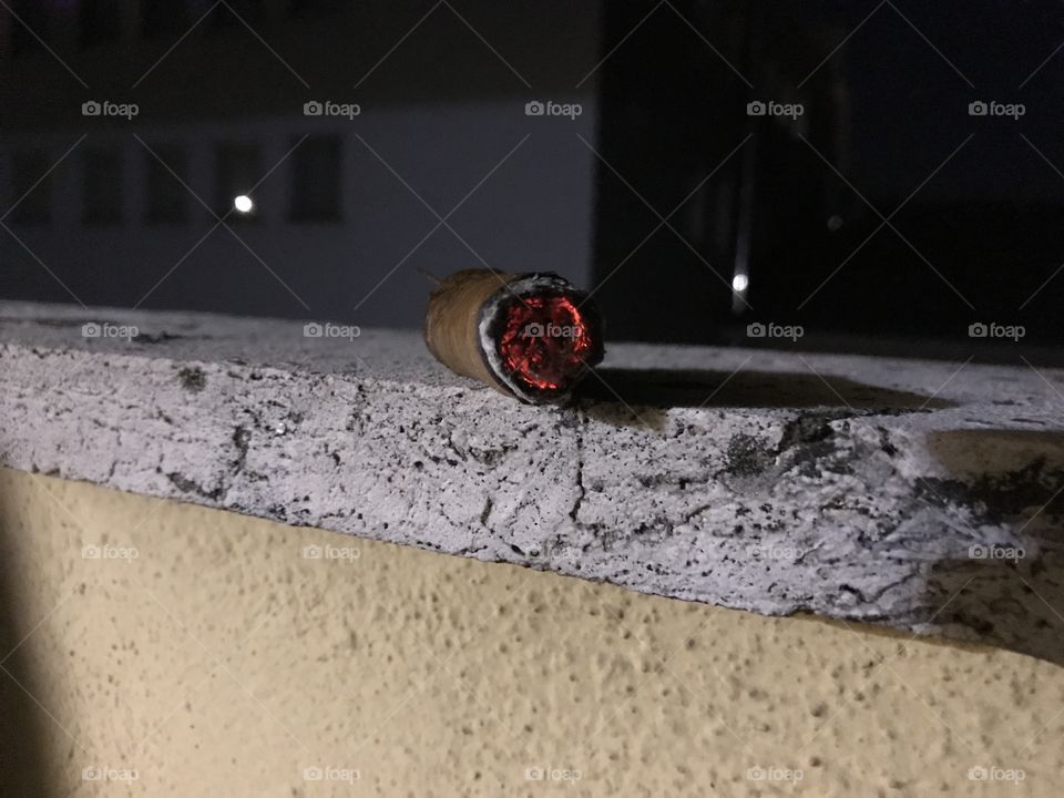 Cigar on rooftop.