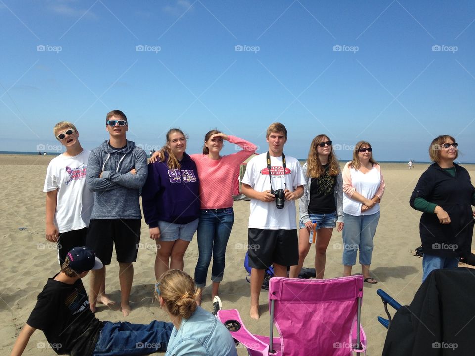 Day at the Beach. Family watching the sky