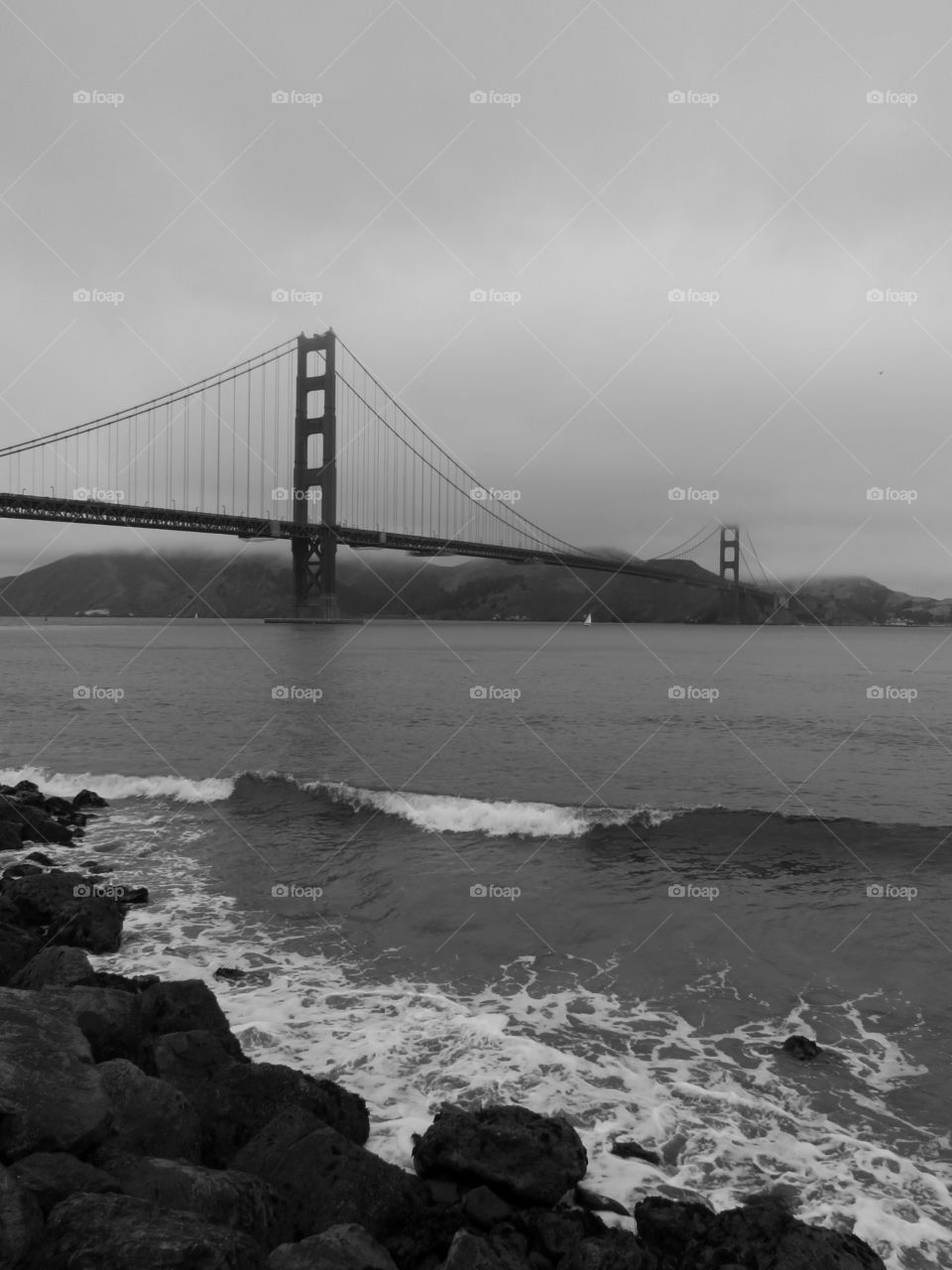 The golden gate bridge is a spectacular sight and the black and white truly brings out its amazing features 
