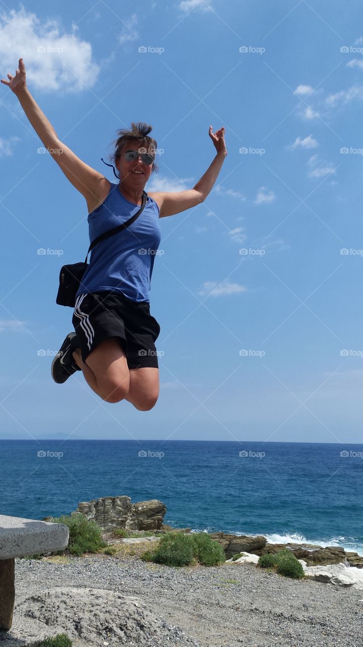 Woman jumping on beach