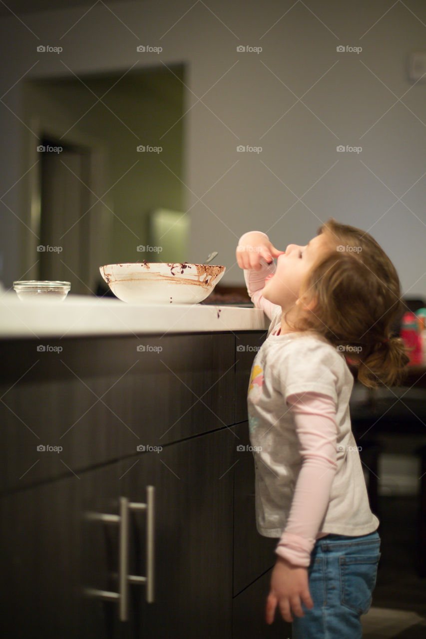 toddler eating batter