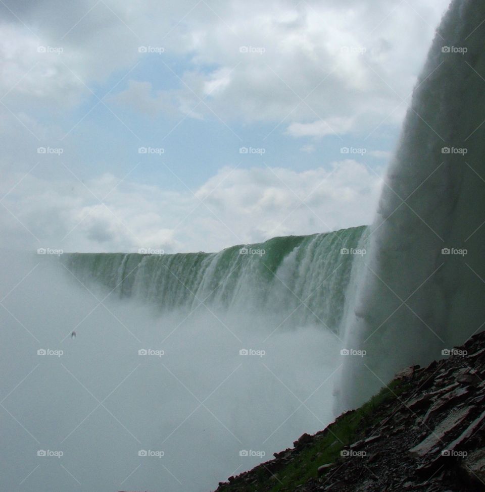 Journey behind the falls. The Canadian horseshoe falls that helps make up the great Niagara Falls 