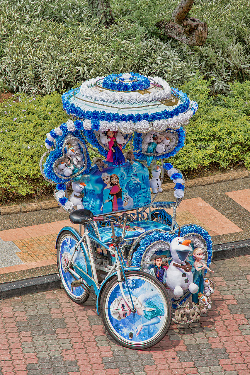 Decorated blue bicycle