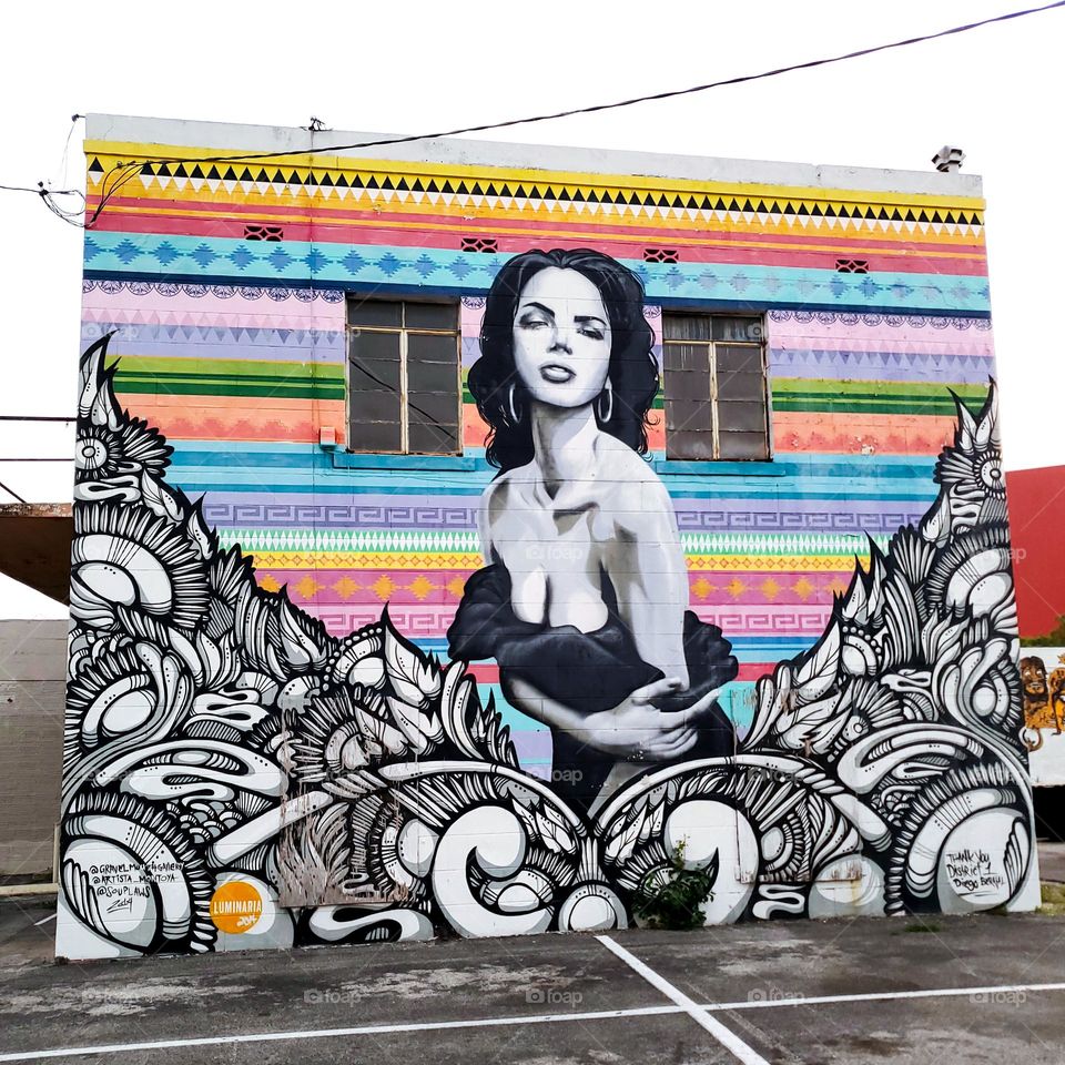 Lady on wall in an urban environment