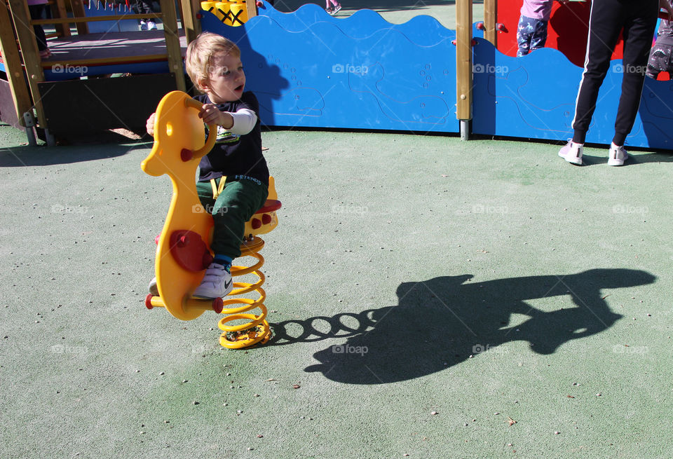 Shadow of playful little boy