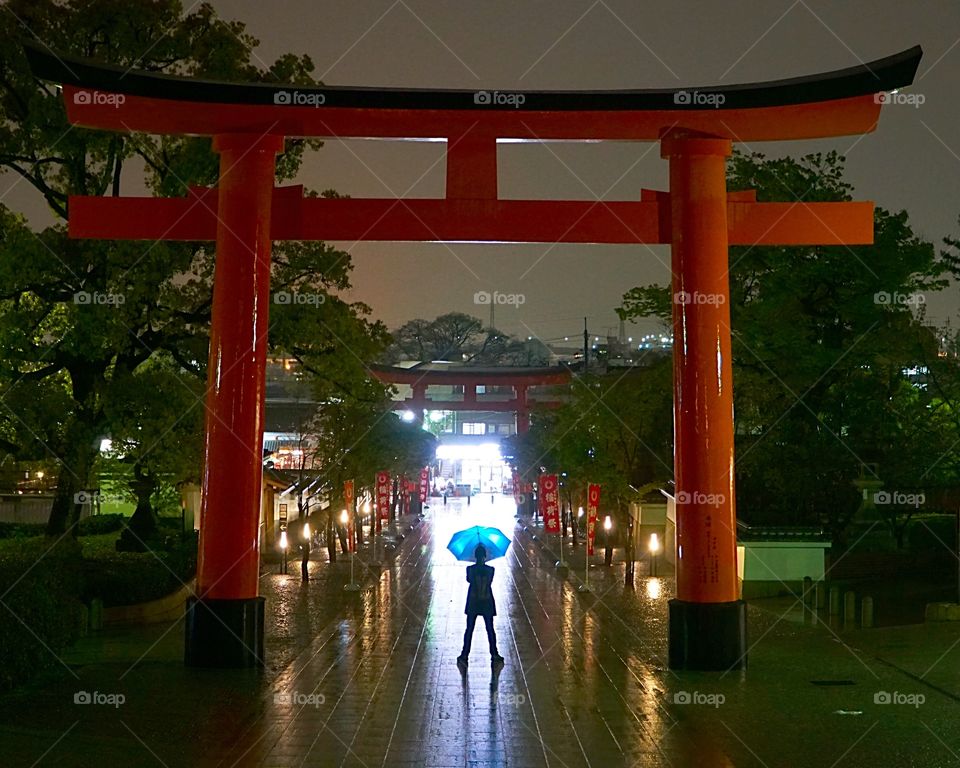 Fushimi inari Shrine Tori gate on a wet night