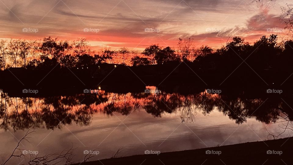 Twilight is awaiting its end for the day. night will be approaching quickly. Awesome Reflections repelled off the Lake Waters. Colours paint a pretty picture on Lake waters.