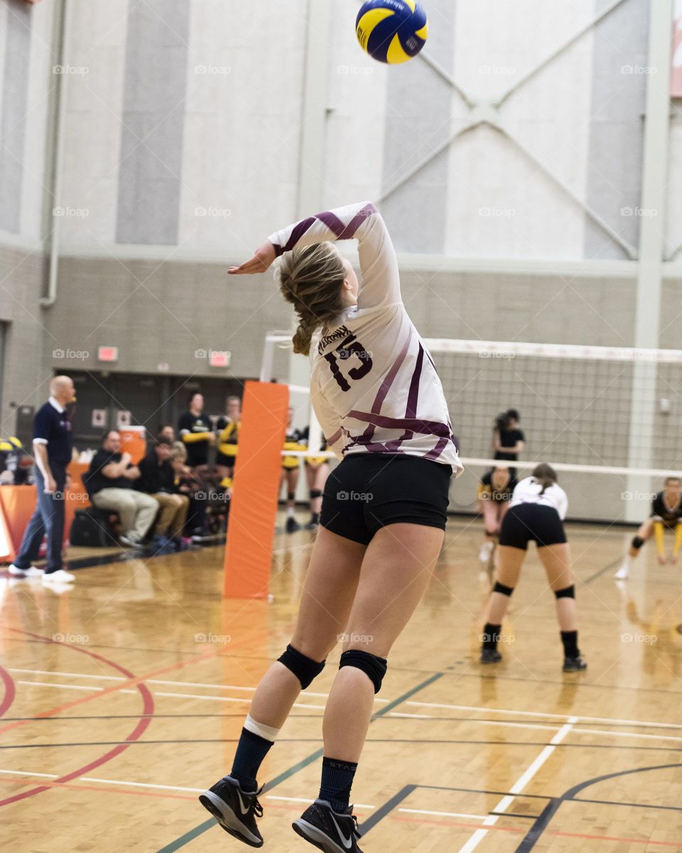Women's Volleyball Player Serving