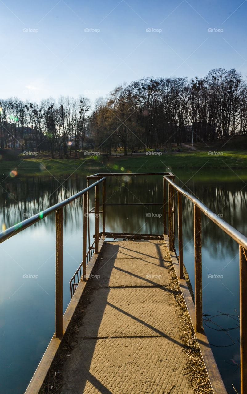 city park with lake in the spring season