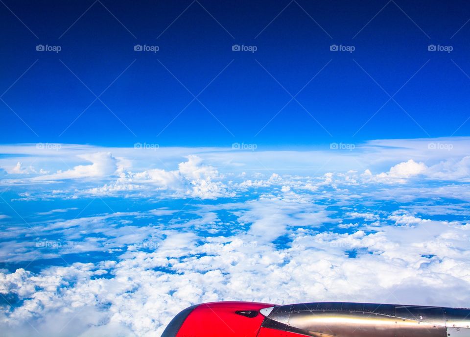 Blue sky and clouds . A click taken from a aircraft of blue skies and clouds it's really mesmerising and deep