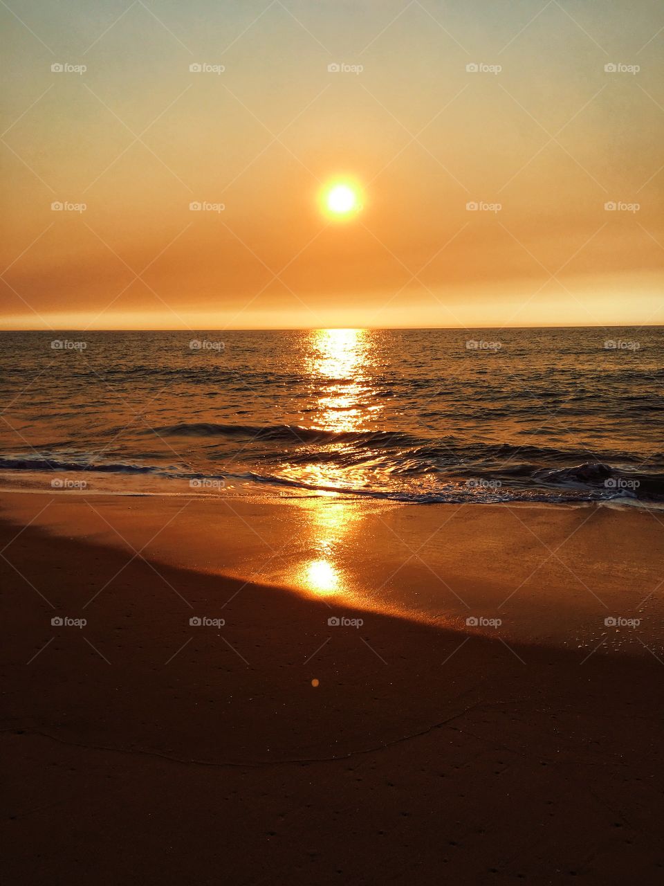Bright orange sunset on the beach