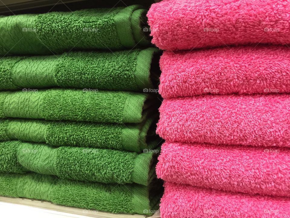 Green And Pink Folded Cotton Towels