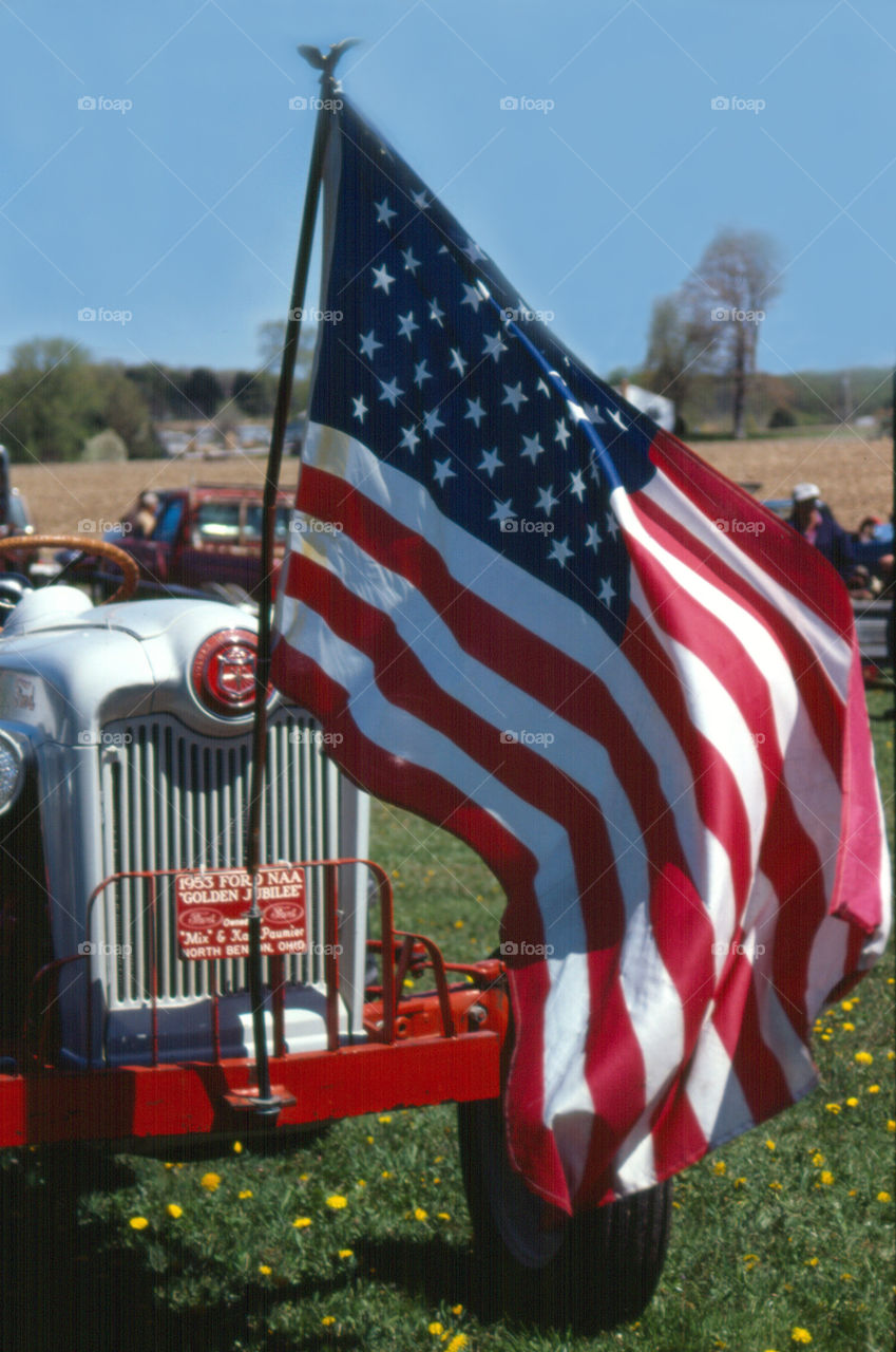 American Flag in a tractor 