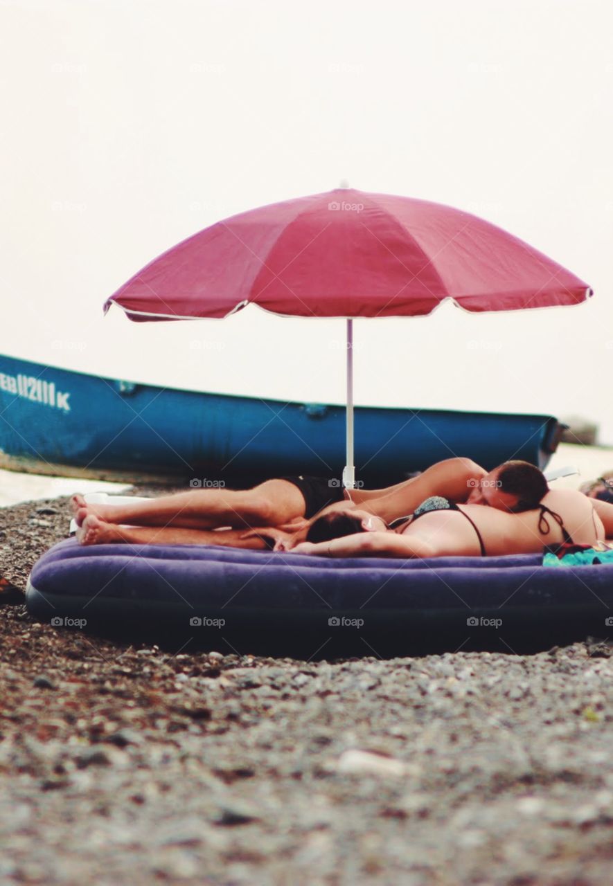 Couple having rest at the beach 