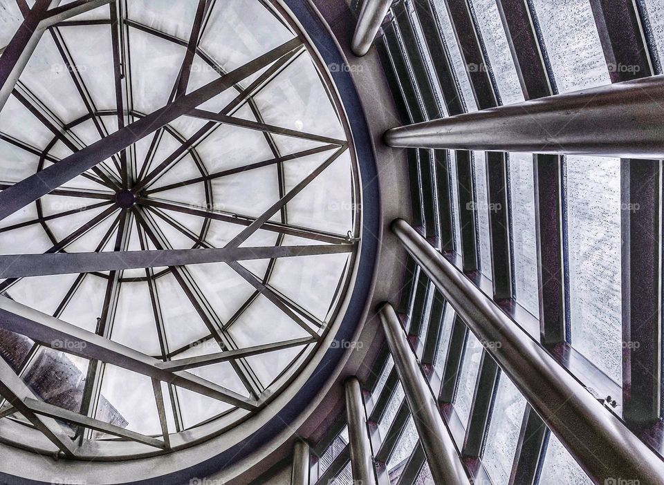 Amateur phone photo photography inside building structure foundation architecture framework Hospital engineered engineering shapes beams Glass windows downwards looking up upwards design arrangement Architectural art cityscapes city interior view