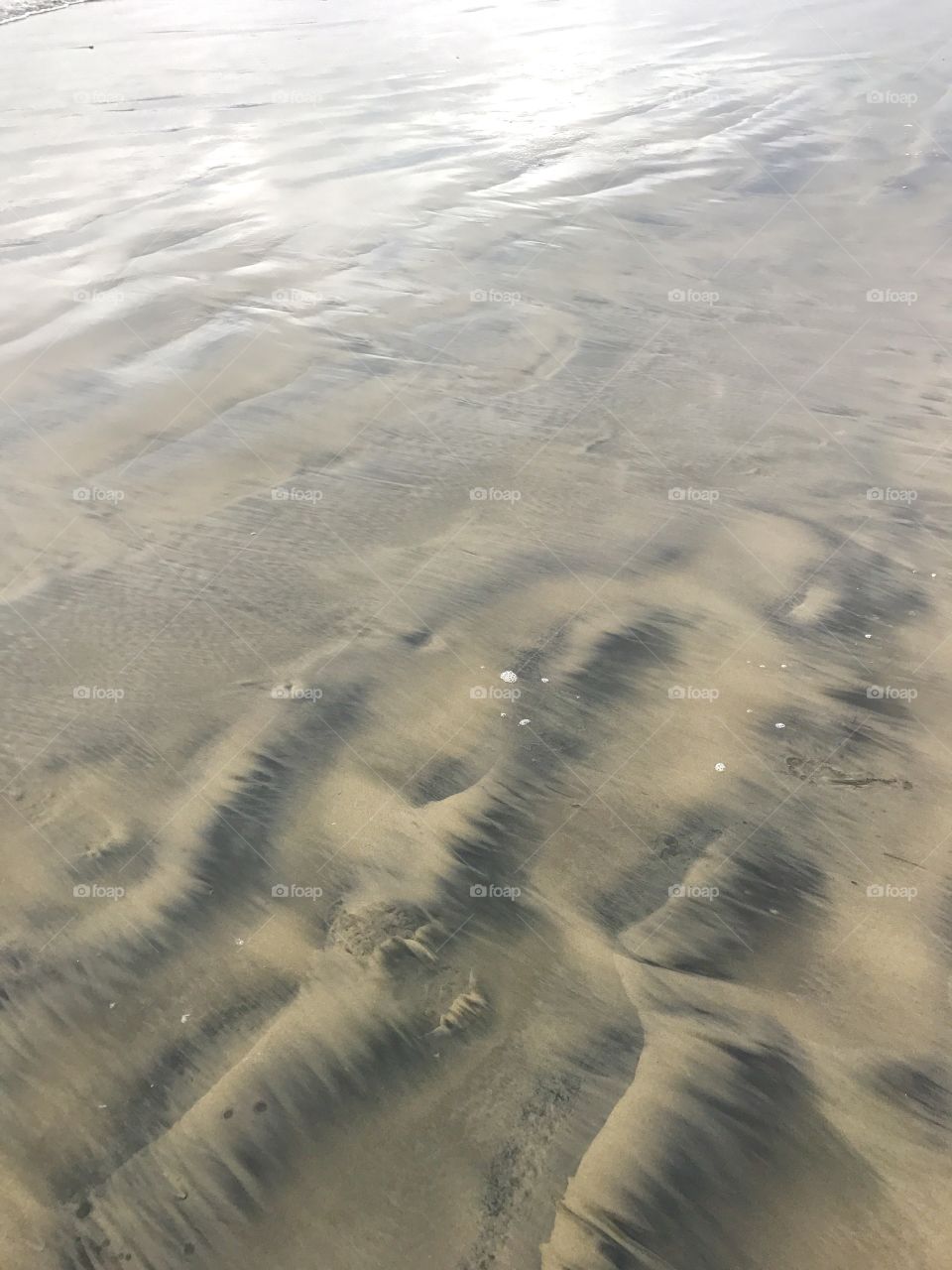 Wet sand on the beach