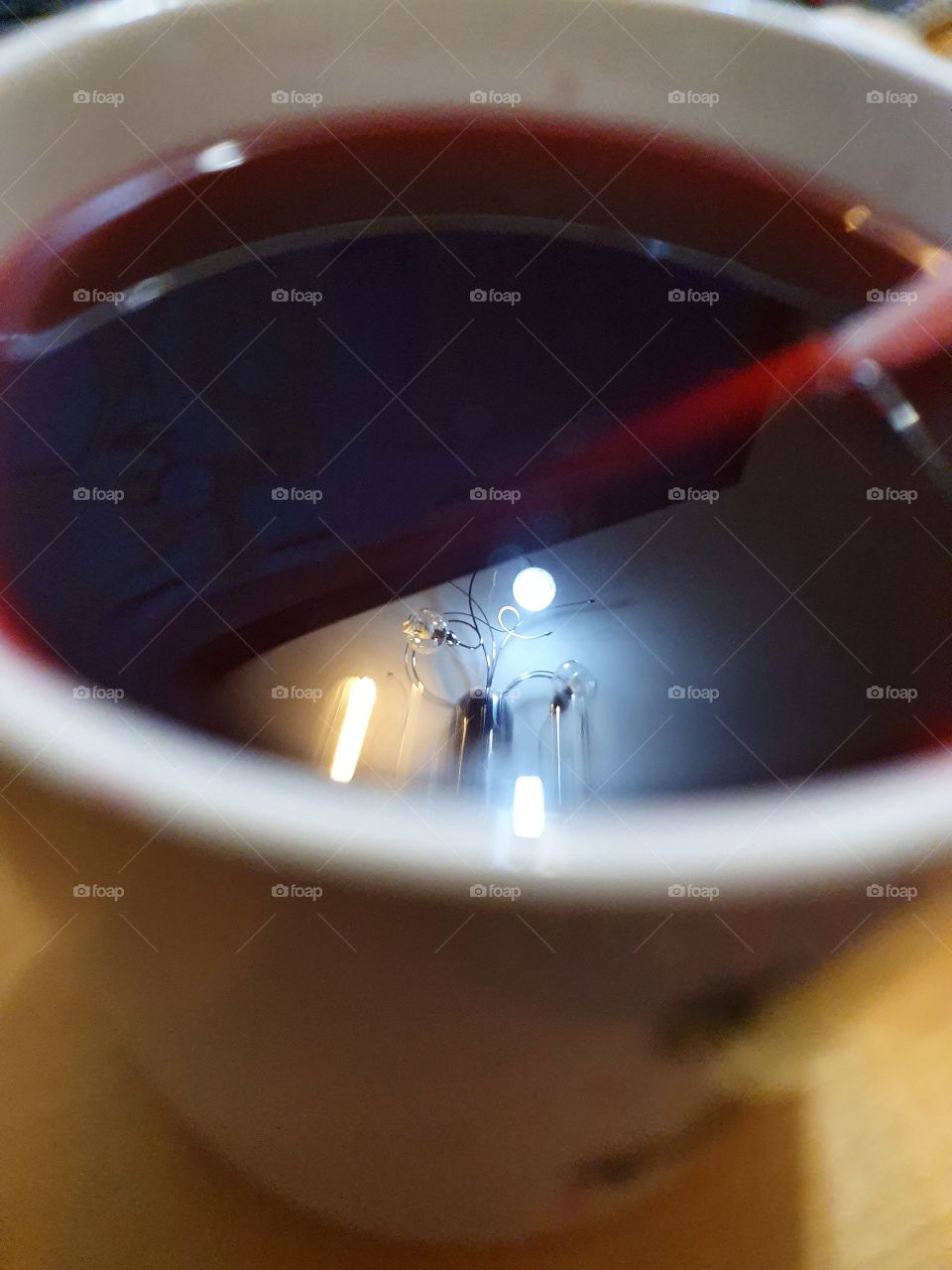 mug with juice and reflection