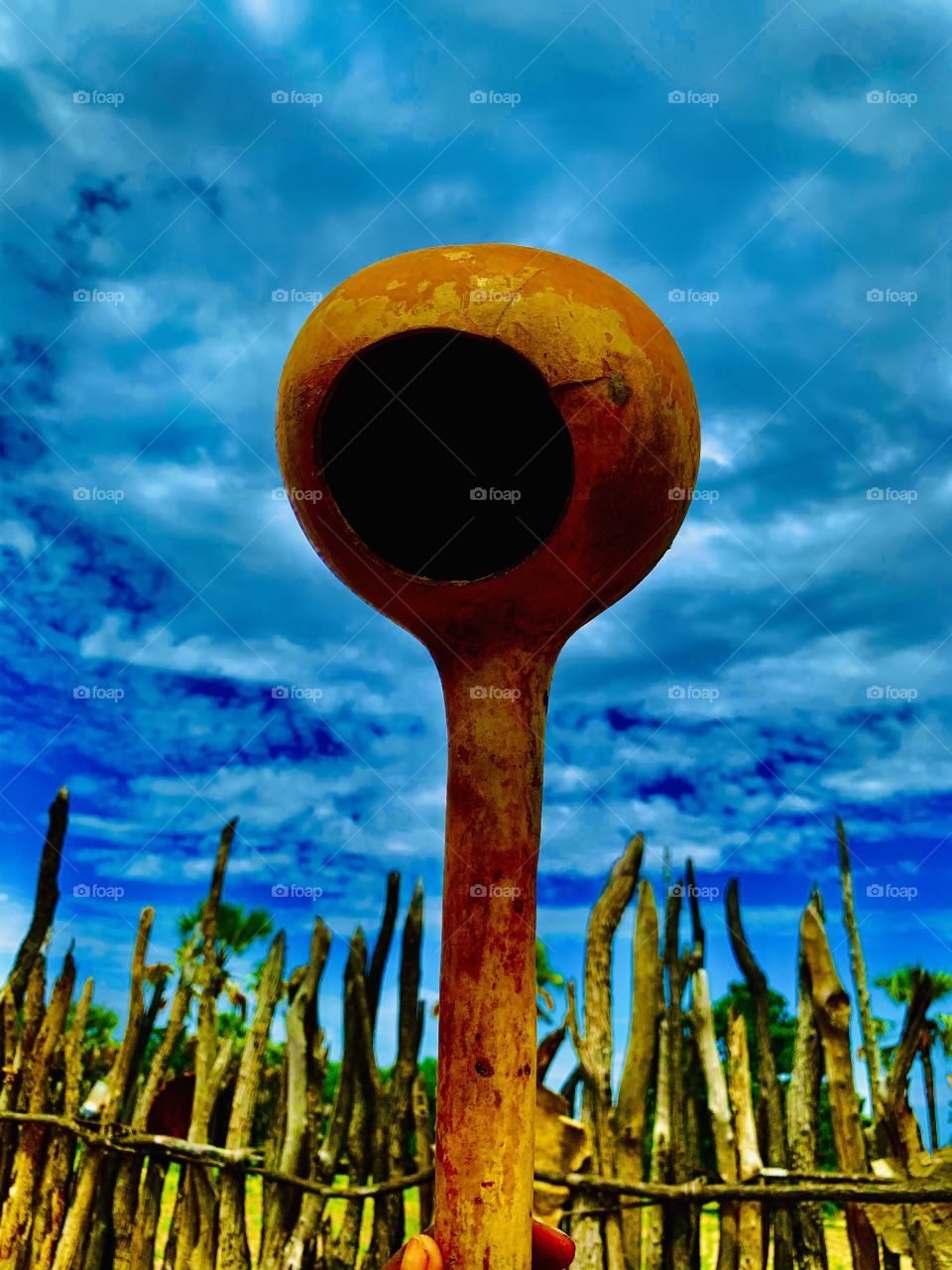 This giant gourd is what we use at home to handle water. That small home was made with a knife. It’s old and ornamental but very useful at the farm.