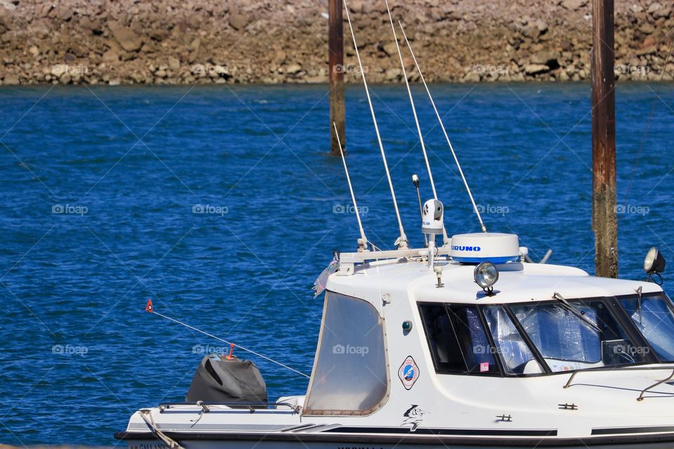 Ocean Sports fishing boat at dock in marina harbour 