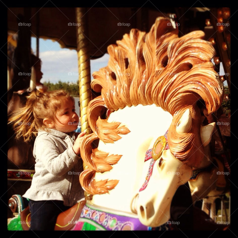 Horseback riding at the carnival.