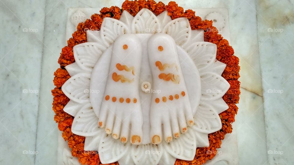 Marble God's feet in temple