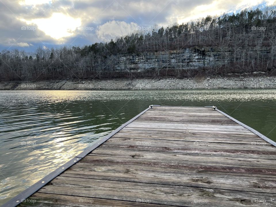 Sun beginning to set on pretty winter day on the dock