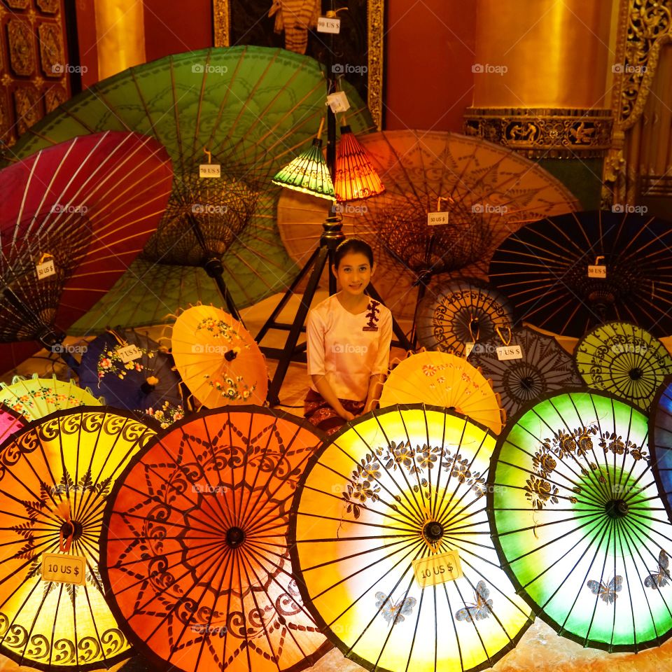 Selling handmade umbrellas at Karaweik Palace on Kandawgyi Lake in Yangon, Myanmar.