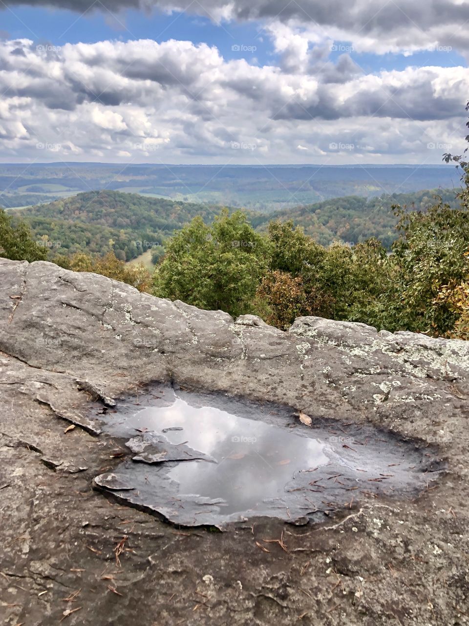 Rain puddle on rocky edge of overlook