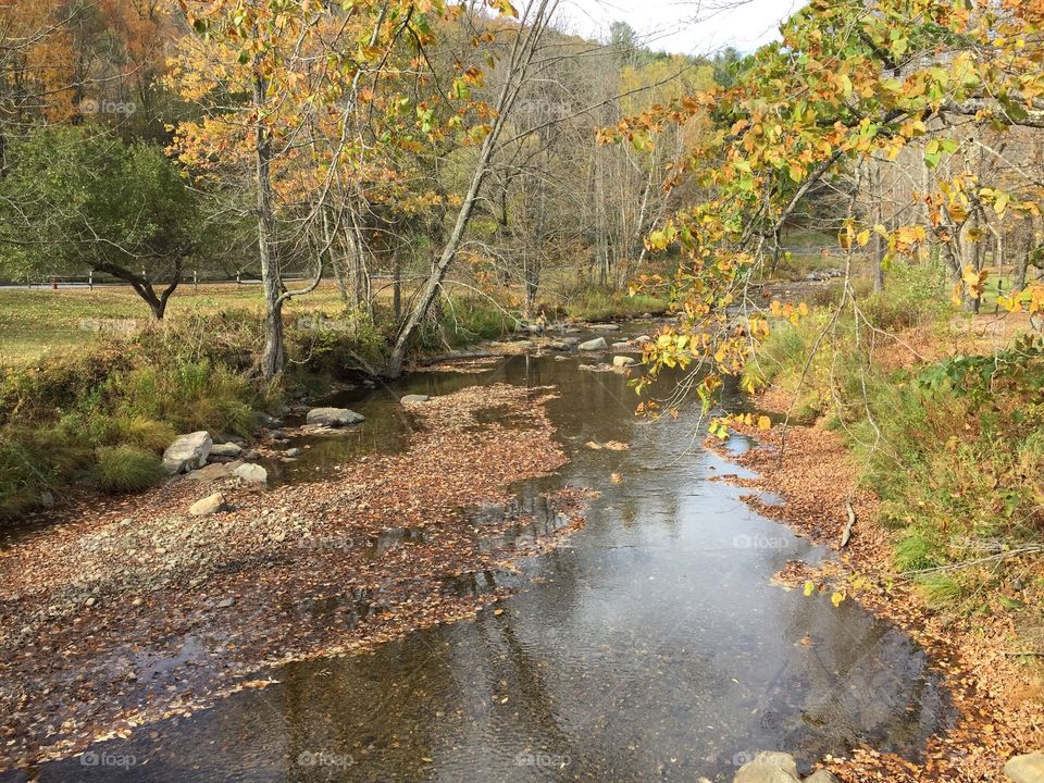 A mountain stream in New England in October. Beautiful fall colors. 