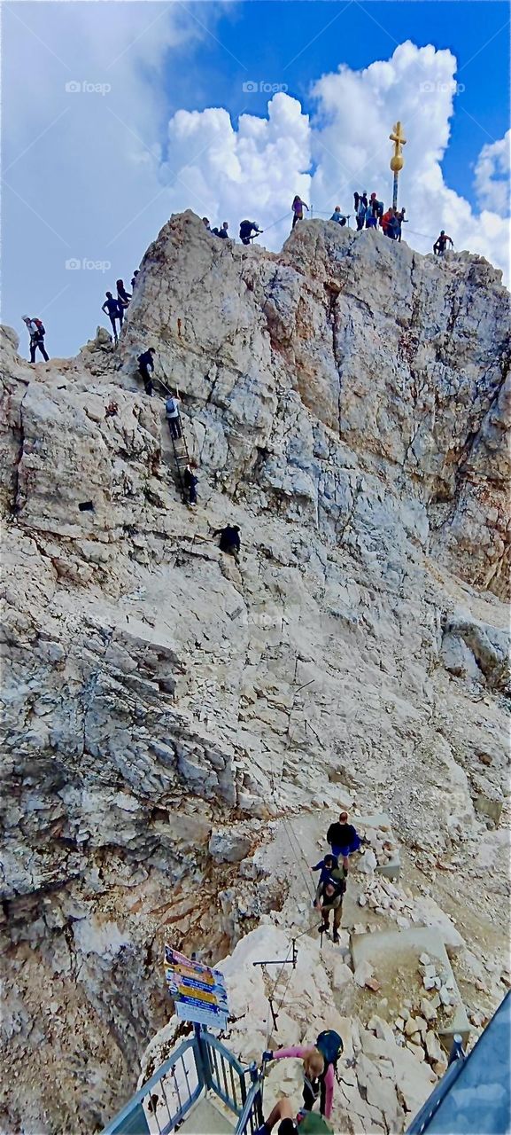 This is the ascent from the “Seilbahn Zugspitze”, the aerial tramway that leads here from “Lake Eibsee” and “Garmisch-Partenkirchen” to below the summit that at 2962 m makes this the tallest mountain in “Bavaria”, Germany. 2024. Hypnotic Productions