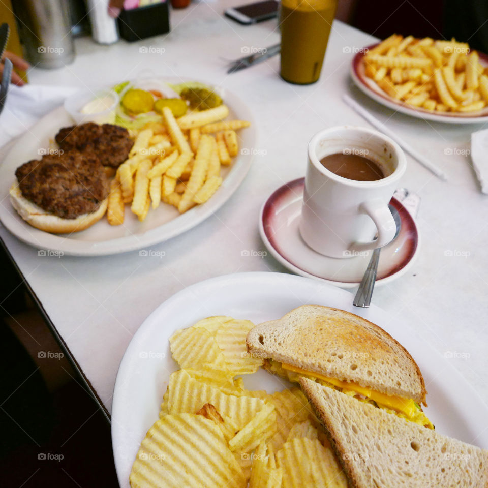 American lunch consisting of burger, sandwich and French fries