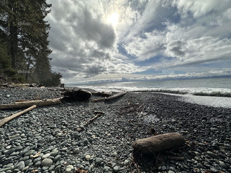 Rocky beach and stormy sky above